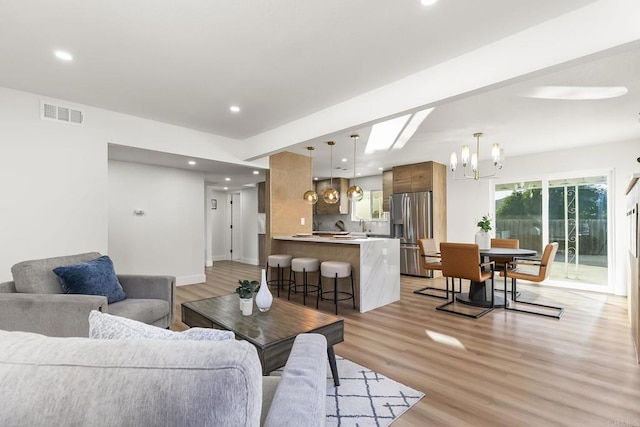 6802 Maury Dr, San Diego, CA 92119 - living room with a chandelier, light wood-style flooring, recessed lighting, and baseboards
