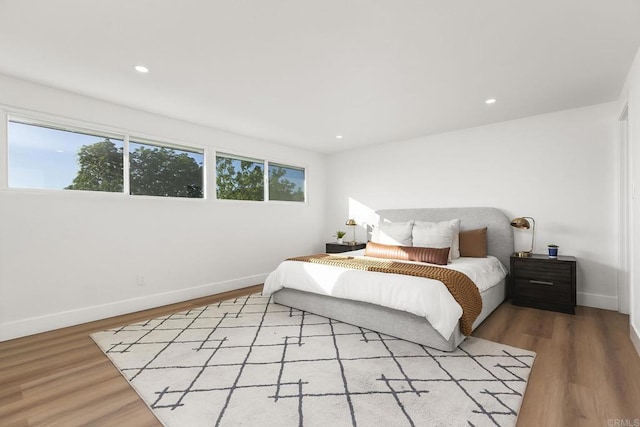 6802 Maury Dr, San Diego, CA 92119 - bedroom featuring baseboards, wood finished floors, and recessed lighting