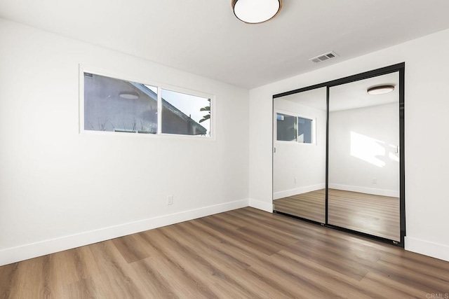 6802 Maury Dr, San Diego, CA 92119 - unfurnished bedroom with wood finished floors, baseboards, and a closet