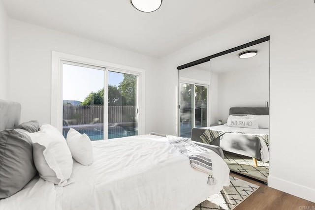 6802 Maury Dr, San Diego, CA 92119 - bedroom featuring access to exterior, wood finished floors, and baseboards