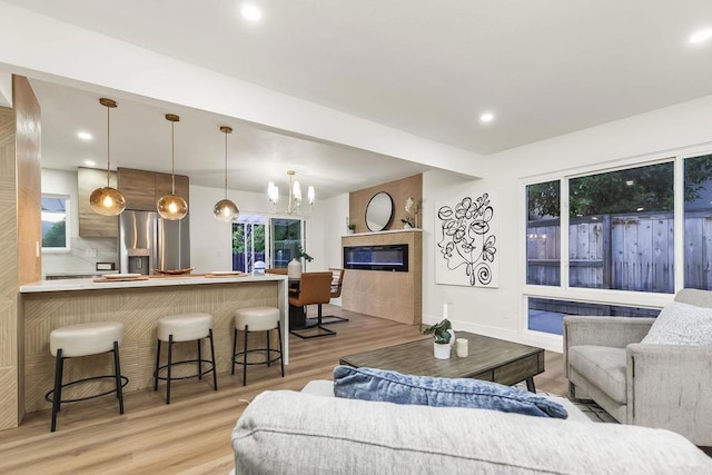 6802 Maury Dr, San Diego, CA 92119 - living area featuring light wood-style floors, a chandelier, and recessed lighting