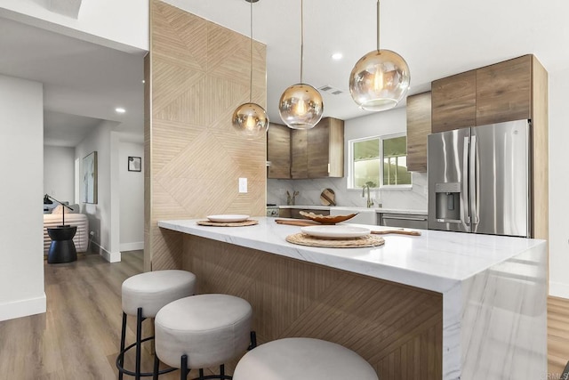 6802 Maury Dr, San Diego, CA 92119 - kitchen with stainless steel fridge, baseboards, light wood-style floors, light countertops, and recessed lighting