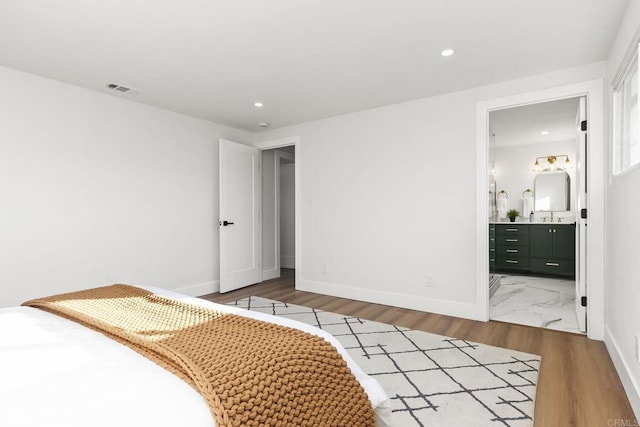 6802 Maury Dr, San Diego, CA 92119 - bedroom featuring baseboards, recessed lighting, wood finished floors, a sink, and ensuite bath