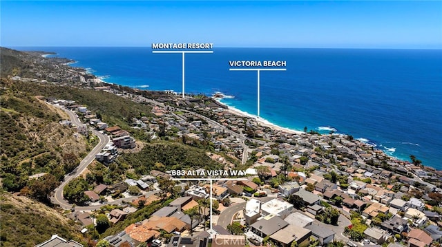 aerial view of residential area with a nearby body of water