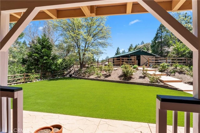 26061 Augusta Dr, Lake Arrowhead, CA 92391 - view of yard featuring an outbuilding, an exterior structure, and a patio