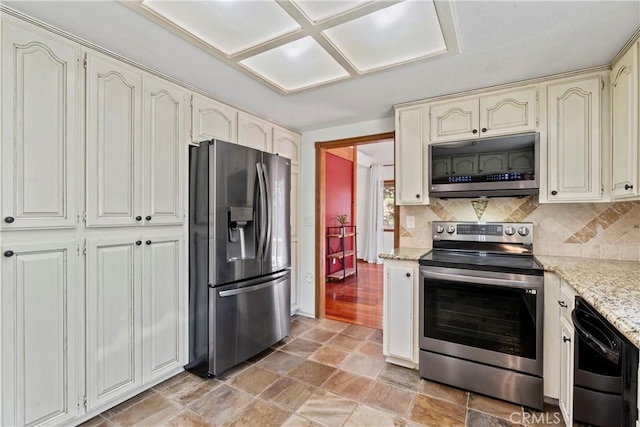 26061 Augusta Dr, Lake Arrowhead, CA 92391 - kitchen with appliances with stainless steel finishes, cream cabinets, backsplash, and light stone counters