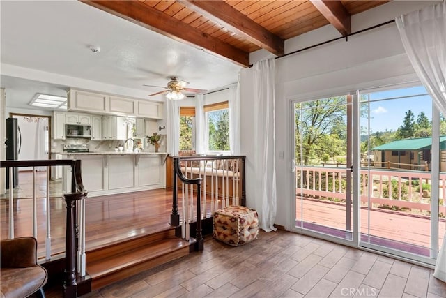 26061 Augusta Dr, Lake Arrowhead, CA 92391 - sunroom / solarium with plenty of natural light, beamed ceiling, and a sink