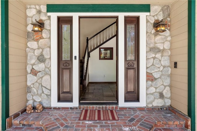 26061 Augusta Dr, Lake Arrowhead, CA 92391 - view of exterior entry featuring stone siding and a porch