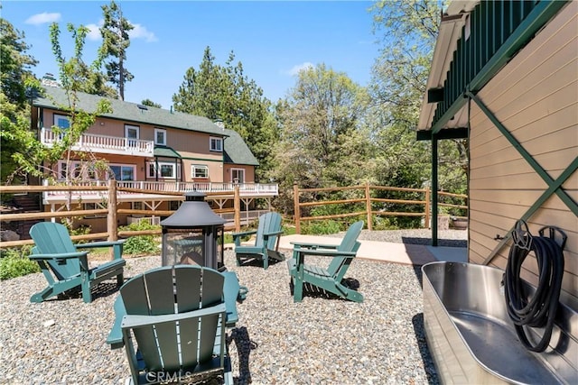 26061 Augusta Dr, Lake Arrowhead, CA 92391 - view of patio / terrace featuring a fire pit and fence