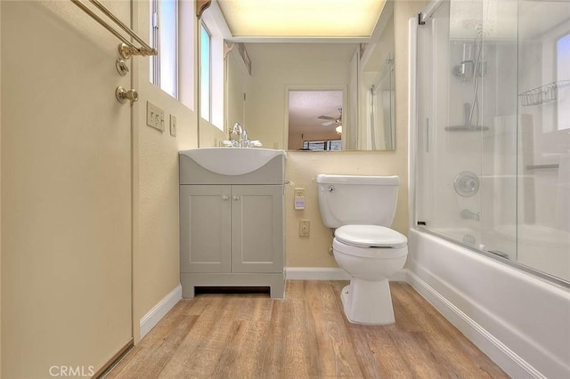 1244 N Albright Ave, Upland, CA 91786 - full bathroom featuring wood finished floors, baseboards, toilet, vanity, and combined bath / shower with glass door