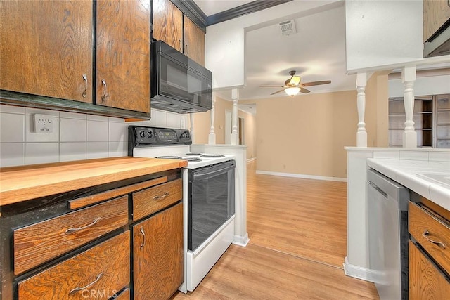 1244 N Albright Ave, Upland, CA 91786 - kitchen with white electric range oven, black microwave, stainless steel dishwasher, crown molding, and light wood-style floors