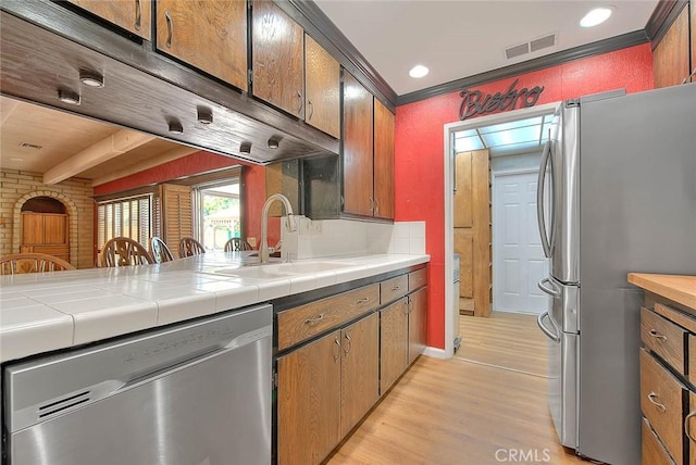 1244 N Albright Ave, Upland, CA 91786 - kitchen with stainless steel appliances, a sink, light wood finished floors, tile countertops, and recessed lighting