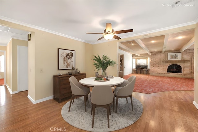 1244 N Albright Ave, Upland, CA 91786 - dining room with light wood-type flooring, baseboards, a ceiling fan, a brick fireplace, and beamed ceiling