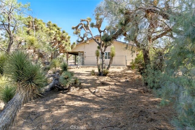 56620 Hidden Gold Dr, Yucca Valley, CA 92284 - view of home's exterior featuring stucco siding