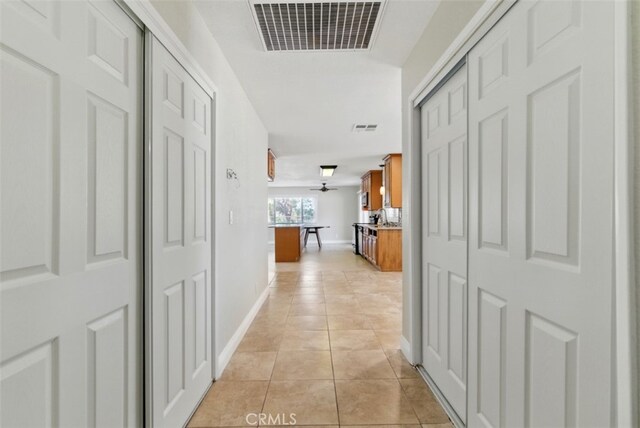 56620 Hidden Gold Dr, Yucca Valley, CA 92284 - hallway featuring light tile patterned flooring and baseboards