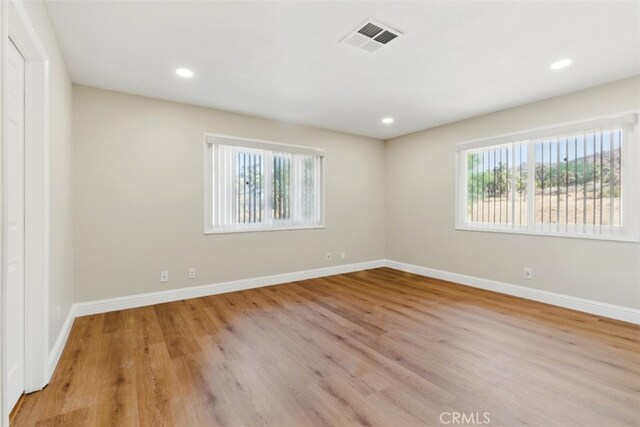 56620 Hidden Gold Dr, Yucca Valley, CA 92284 - empty room featuring wood finished floors, baseboards, and recessed lighting