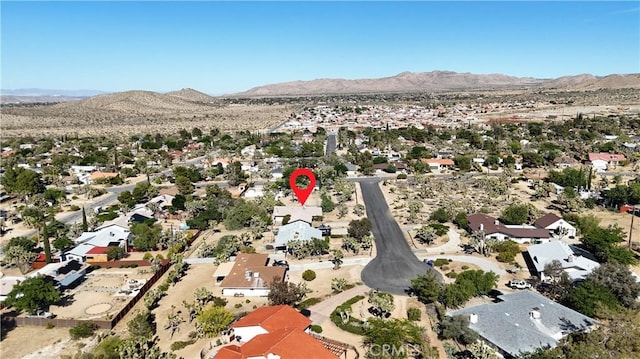 56620 Hidden Gold Dr, Yucca Valley, CA 92284 - view of property location featuring a mountainous background and nearby suburban area
