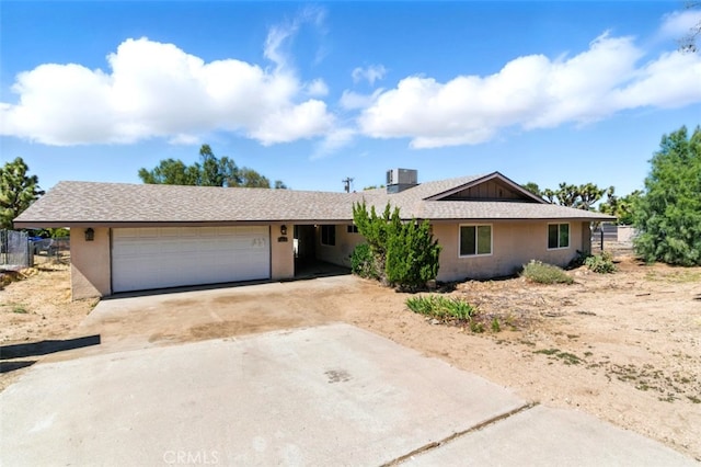 56620 Hidden Gold Dr, Yucca Valley, CA 92284 - ranch-style home featuring a garage and concrete driveway