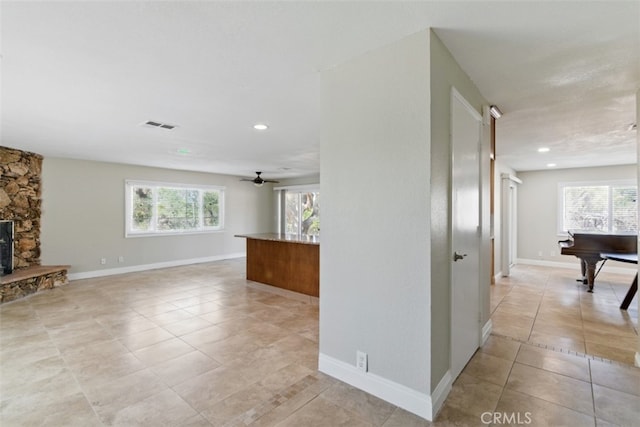 56620 Hidden Gold Dr, Yucca Valley, CA 92284 - unfurnished living room featuring light tile patterned flooring, recessed lighting, baseboards, and ceiling fan