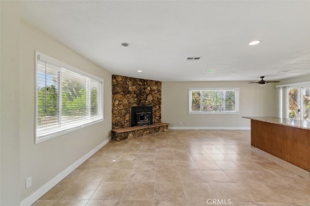 56620 Hidden Gold Dr, Yucca Valley, CA 92284 - unfurnished living room with plenty of natural light, baseboards, recessed lighting, a ceiling fan, and light tile patterned floors