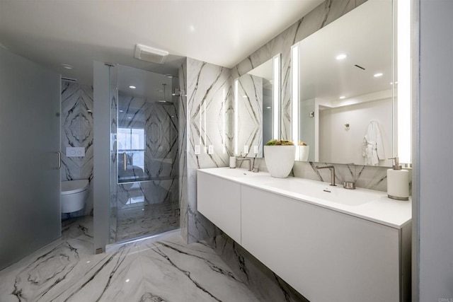 full bath featuring a marble finish shower, toilet, marble tiled flooring, double vanity, and recessed lighting
