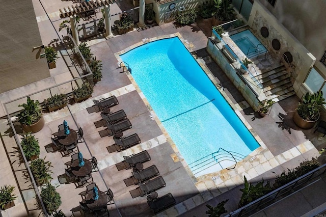 community pool with a patio
