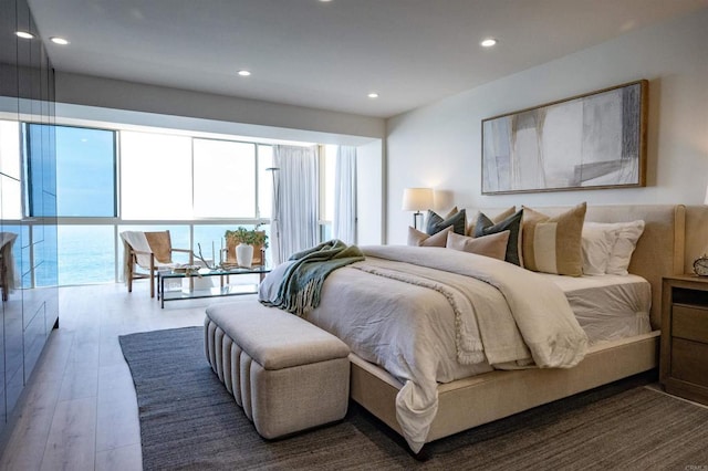 bedroom featuring recessed lighting and wood finished floors