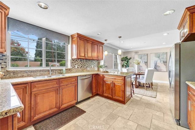 15605 Facilidad St, Hacienda Heights, CA 91745 - kitchen with stainless steel appliances, a sink, a peninsula, brown cabinets, and ornamental molding