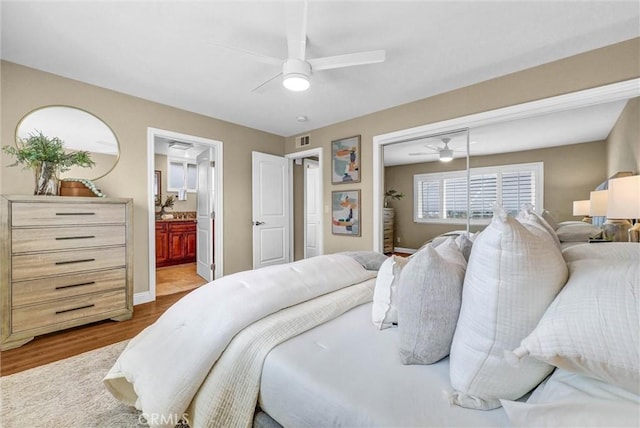 15605 Facilidad St, Hacienda Heights, CA 91745 - bedroom featuring wood finished floors, a closet, connected bathroom, ceiling fan, and baseboards