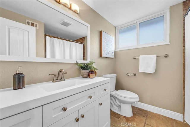 15605 Facilidad St, Hacienda Heights, CA 91745 - bathroom with toilet, vanity, and baseboards