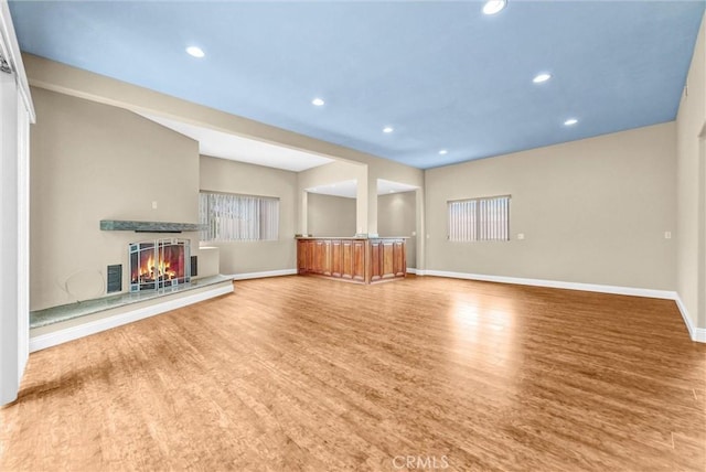 15605 Facilidad St, Hacienda Heights, CA 91745 - unfurnished living room with baseboards, wood finished floors, recessed lighting, and a lit fireplace