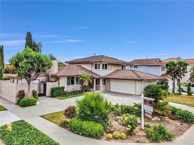 15605 Facilidad St, Hacienda Heights, CA 91745 - multi unit property featuring concrete driveway, a garage, a tile roof, and stucco siding