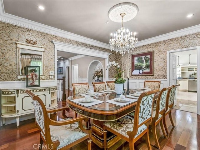 2560 Raleigh Dr, San Marino, CA 91108 - dining room featuring wallpapered walls, ornamental molding, a wainscoted wall, a chandelier, and wood finished floors