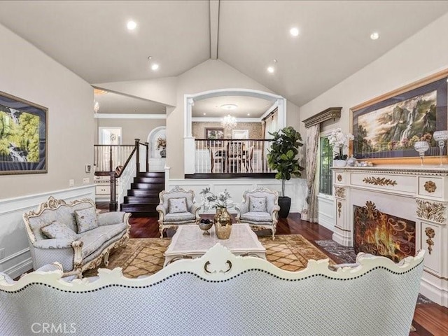 2560 Raleigh Dr, San Marino, CA 91108 - living room with stairway, a wainscoted wall, a chandelier, wood finished floors, and lofted ceiling