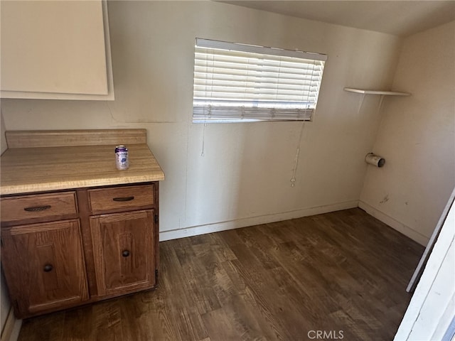 9238 Bonita Vis, Apple Valley, CA 92308 - clothes washing area featuring dark wood-style floors