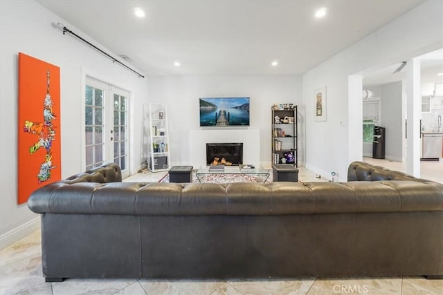 1301 N Orange Grove Ave, West Hollywood, CA 90046 - living room with recessed lighting, a fireplace, and baseboards