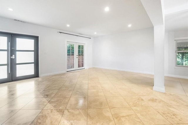 1301 N Orange Grove Ave, West Hollywood, CA 90046 - unfurnished room with french doors, plenty of natural light, recessed lighting, light tile patterned flooring, and baseboards