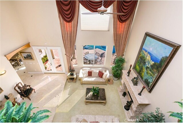 7280 Brandon Ct, Riverside, CA 92506 - living area with a towering ceiling, french doors, ceiling fan, and tile patterned floors