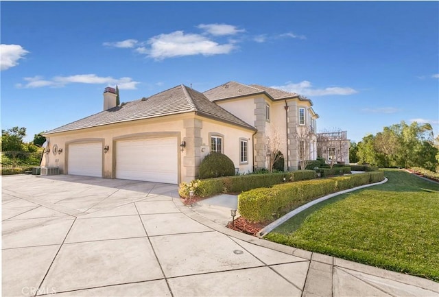 7280 Brandon Ct, Riverside, CA 92506 - view of front of property featuring stucco siding, a chimney, driveway, a front yard, and a garage