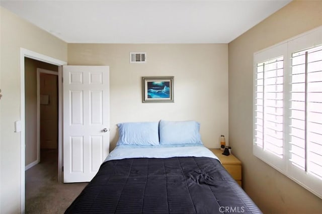 7391 Margerum Ave, San Diego, CA 92120 - carpeted bedroom with multiple windows and baseboards