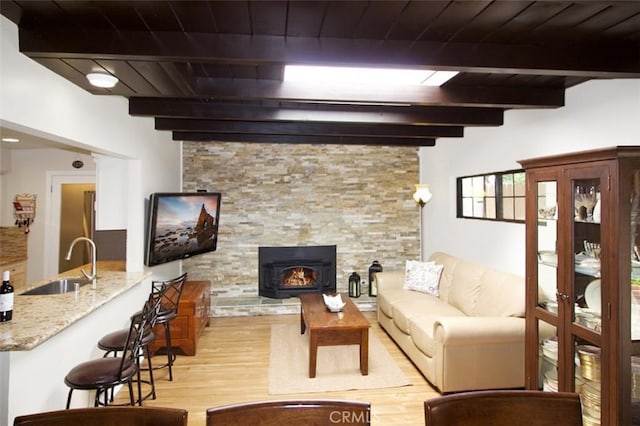 7391 Margerum Ave, San Diego, CA 92120 - living room with light wood-style flooring and wood ceiling with exposed beams