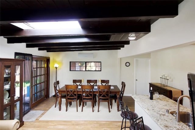 7391 Margerum Ave, San Diego, CA 92120 - dining space with beam ceiling, light wood-style floors, french doors, and baseboards