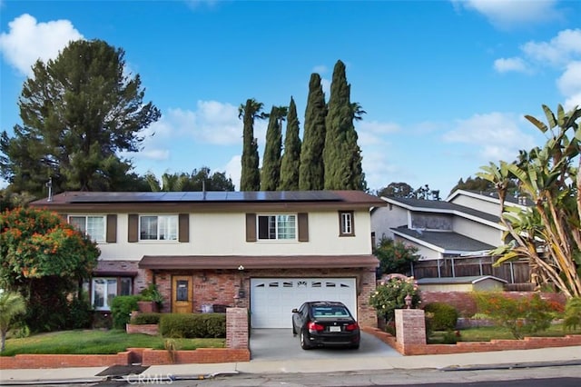 7391 Margerum Ave, San Diego, CA 92120 - view of front of property featuring concrete driveway, solar panels, an attached garage, brick siding, and stucco siding