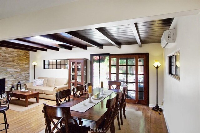 7391 Margerum Ave, San Diego, CA 92120 - dining area with beamed ceiling, wood finished floors, baseboards, an AC wall unit, and french doors