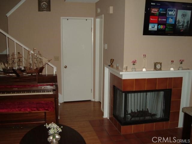 2452 Chandler Ave Unit 1, Simi Valley, CA 93065 - bar area featuring a tiled fireplace and wood finished floors