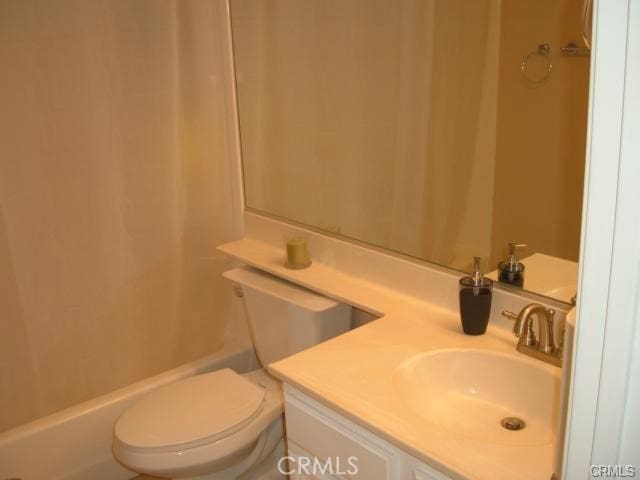 2452 Chandler Ave Unit 1, Simi Valley, CA 93065 - bathroom featuring toilet, vanity, and shower / bathtub combination with curtain