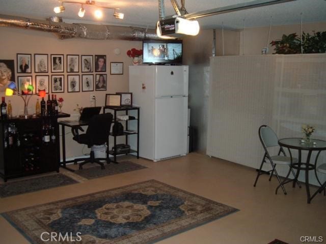 2452 Chandler Ave Unit 1, Simi Valley, CA 93065 - garage featuring freestanding refrigerator and a garage door opener