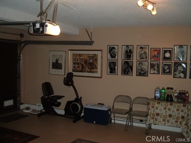 2452 Chandler Ave Unit 1, Simi Valley, CA 93065 - workout area with a textured ceiling and a garage