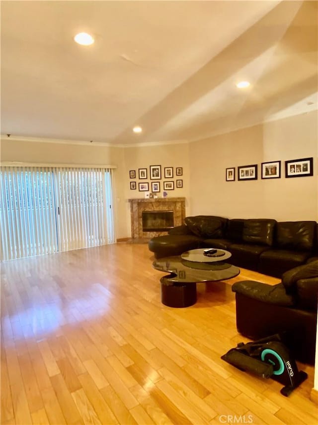 14919 Dickens St Unit 105, Sherman Oaks, CA 91403 - living area with a high end fireplace, wood finished floors, crown molding, and recessed lighting