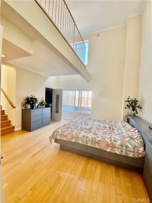 14919 Dickens St Unit 105, Sherman Oaks, CA 91403 - bedroom featuring hardwood / wood-style floors and a high ceiling